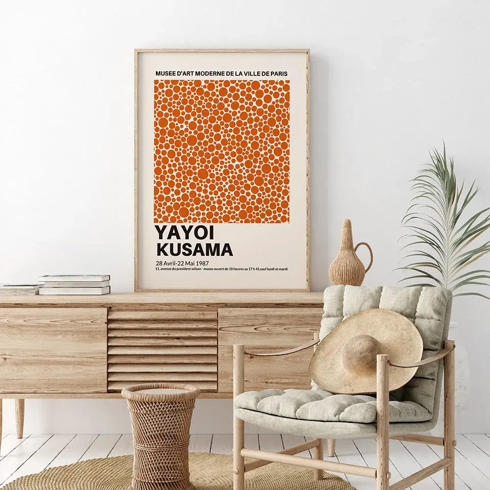 Elegant interior with Japendi art by Yayoi Kusama, featuring an abstract orange dot design, styled with modern wooden furniture.