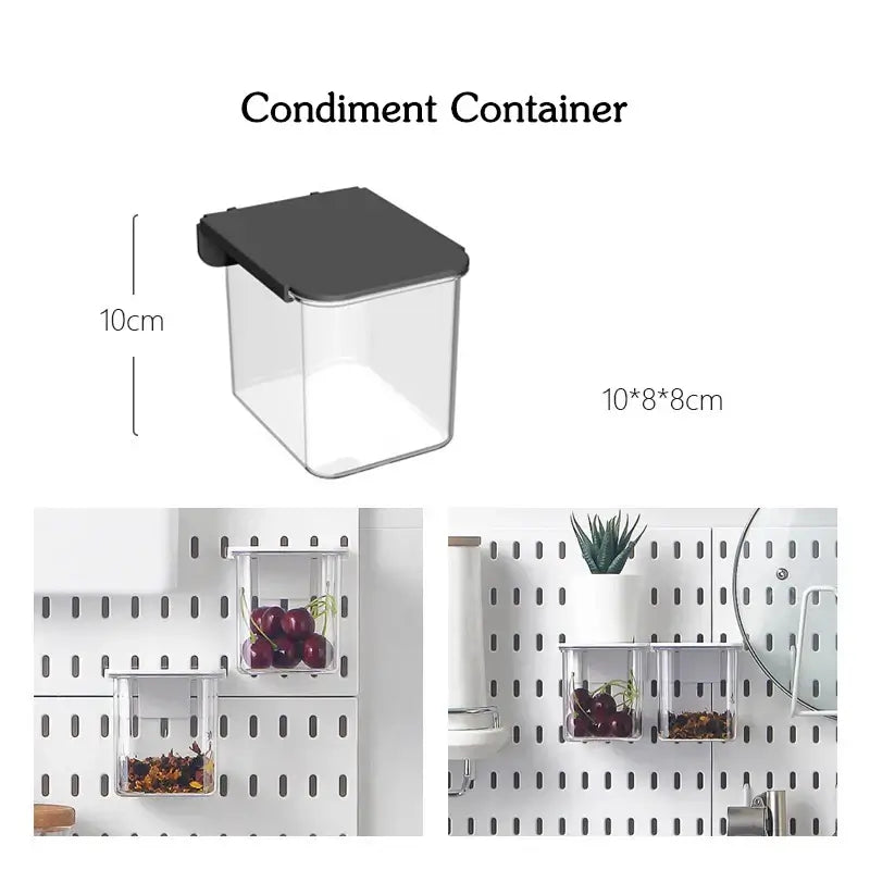 Transparent condiment container with black lid, perfect for hanging on a wall-mounted storage panel, dimensions 10x8x8 cm.