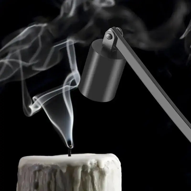 Mat black metal candle snuffer extinguishing a candle, with smoke trail - ideal for safe candle use without wax spills.