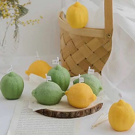 Handmade citron-scented candle in lemon shape, made from soy wax, displayed with green and yellow lemon candles for a fresh decor.