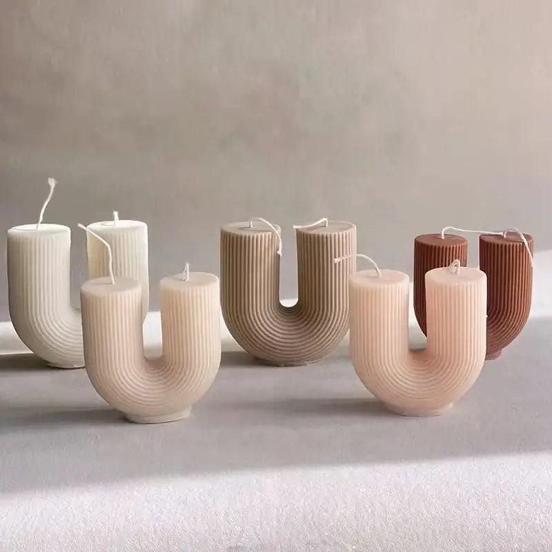 Collection of U-shaped handcrafted soy wax candles in neutral tones, perfect for modern and minimalist home decor