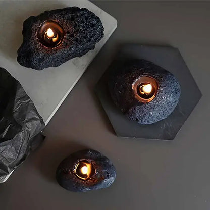 Decorative meteorite-shaped scented candles creating a warm and calming atmosphere.