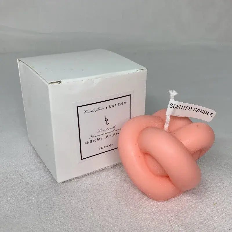 Pink geometric knot scented candle with packaging box