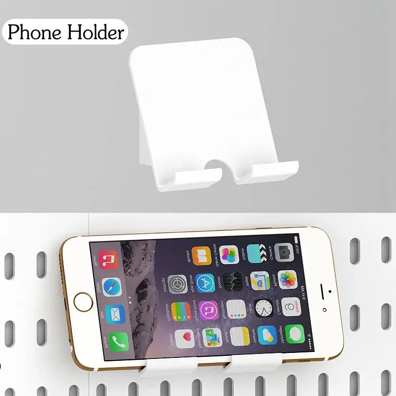 Wall-mounted white phone holder displaying smartphone organizers.