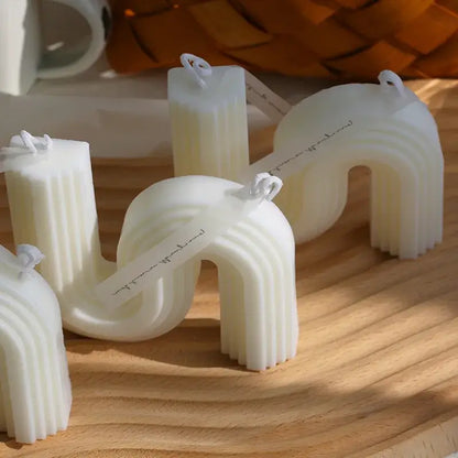 Zigzag aromatic soy wax candles with sculptural design on wooden surface.