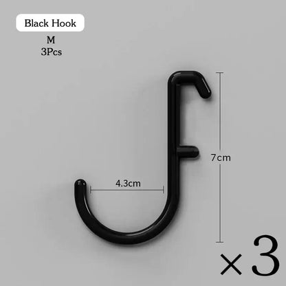 Set of 3 black wall hooks measuring 7 cm x 4.3 cm for hanging and organizing items.