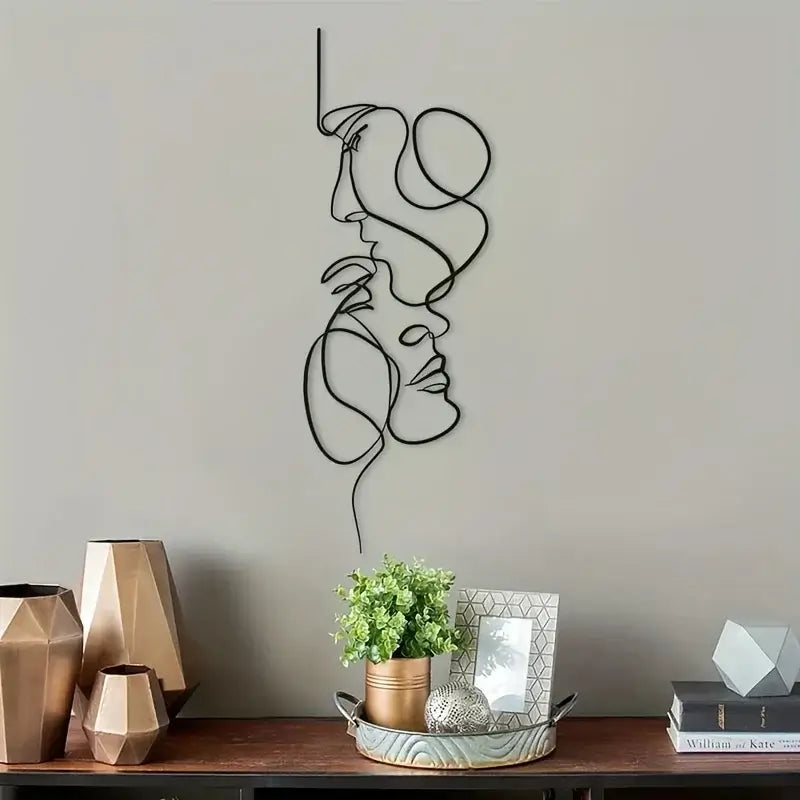 Modern metal wall decor with two faces in a minimalist design, perfect for contemporary interiors