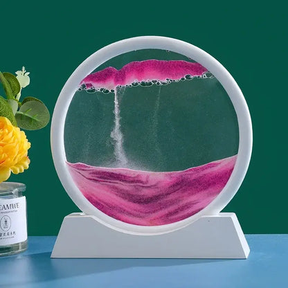 Sablier décoratif circulaire en verre de haute qualité avec sable rose sur support, ajoutant une touche élégante à la décoration intérieure