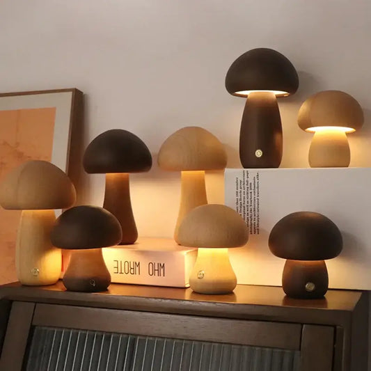 Collection of wooden mushroom-shaped table lamps on a cabinet, creating a warm and cozy atmosphere.