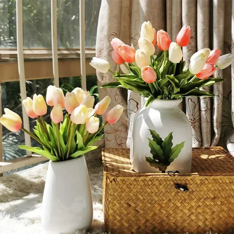 Two vases of silk tulip bouquets in a sunlit room, perfect for elegant home decor and special occasions like weddings and parties.