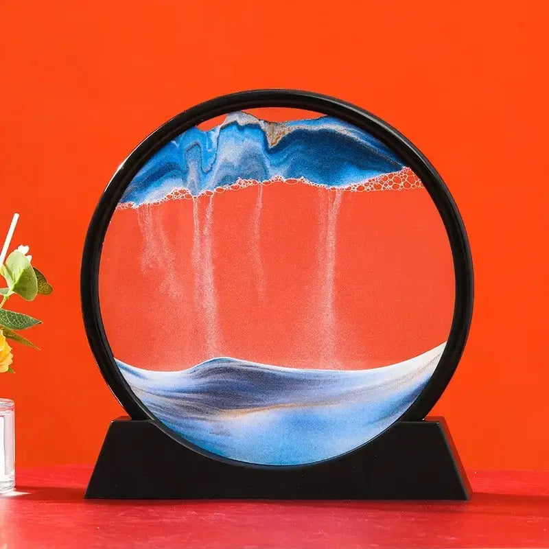 Sablier décoratif circulaire en verre de haute qualité avec effet de sable bleu et blanc sur fond orange vibrant