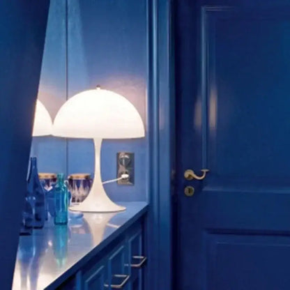 Minimalist LED mushroom lamp illuminating a modern room with blue interior design, creating a sophisticated ambiance.